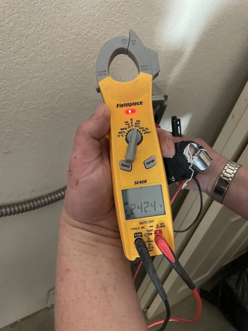 Voltage testing with clamp meter during Generator Installation in Lincoln Village